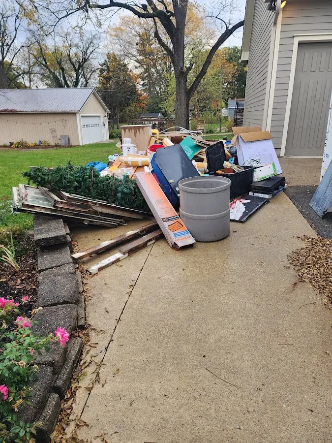 Dumpster being loaded with debris for Residential Dumpster Rental in Ocean City